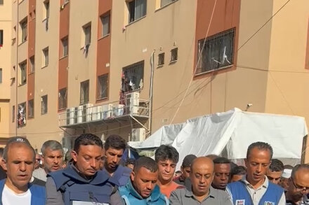 A Palestinian television reporter is killed, along with 11 family members, in southern Gaza.