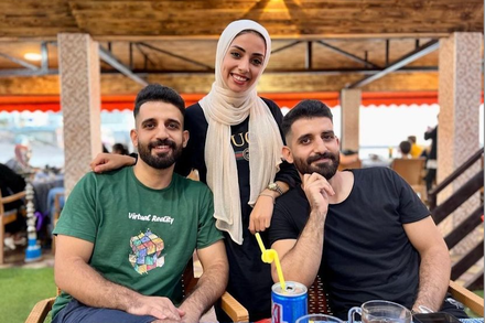 A Palestinian photographer put his camera down to try to rescue his relatives.