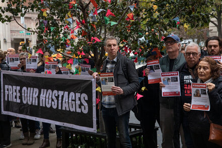 Protesters rally outside the U.N. secretary general’s residence to demand action on the hostages.
