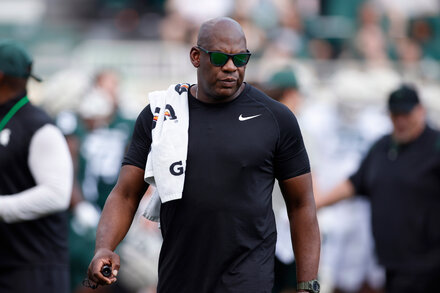 Michigan State Seeks to Fire Football Coach Amid Sexual Harassment Case