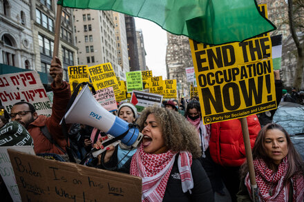 Pro-Palestinian Protesters Targeting Wall St. Denounce U.S. Veto of U.N. Cease-Fire Resolution
